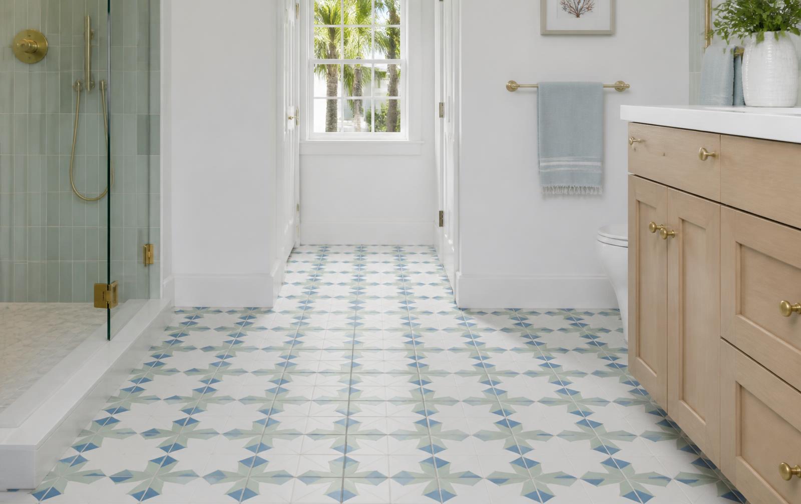 Bright bathroom with blue and green patterned porcelain floor tile